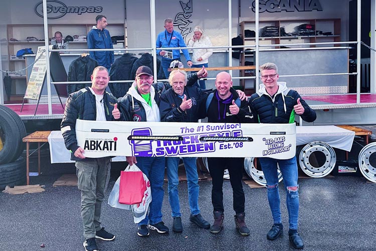 Five men holding a sun visor from truckstyle sweden